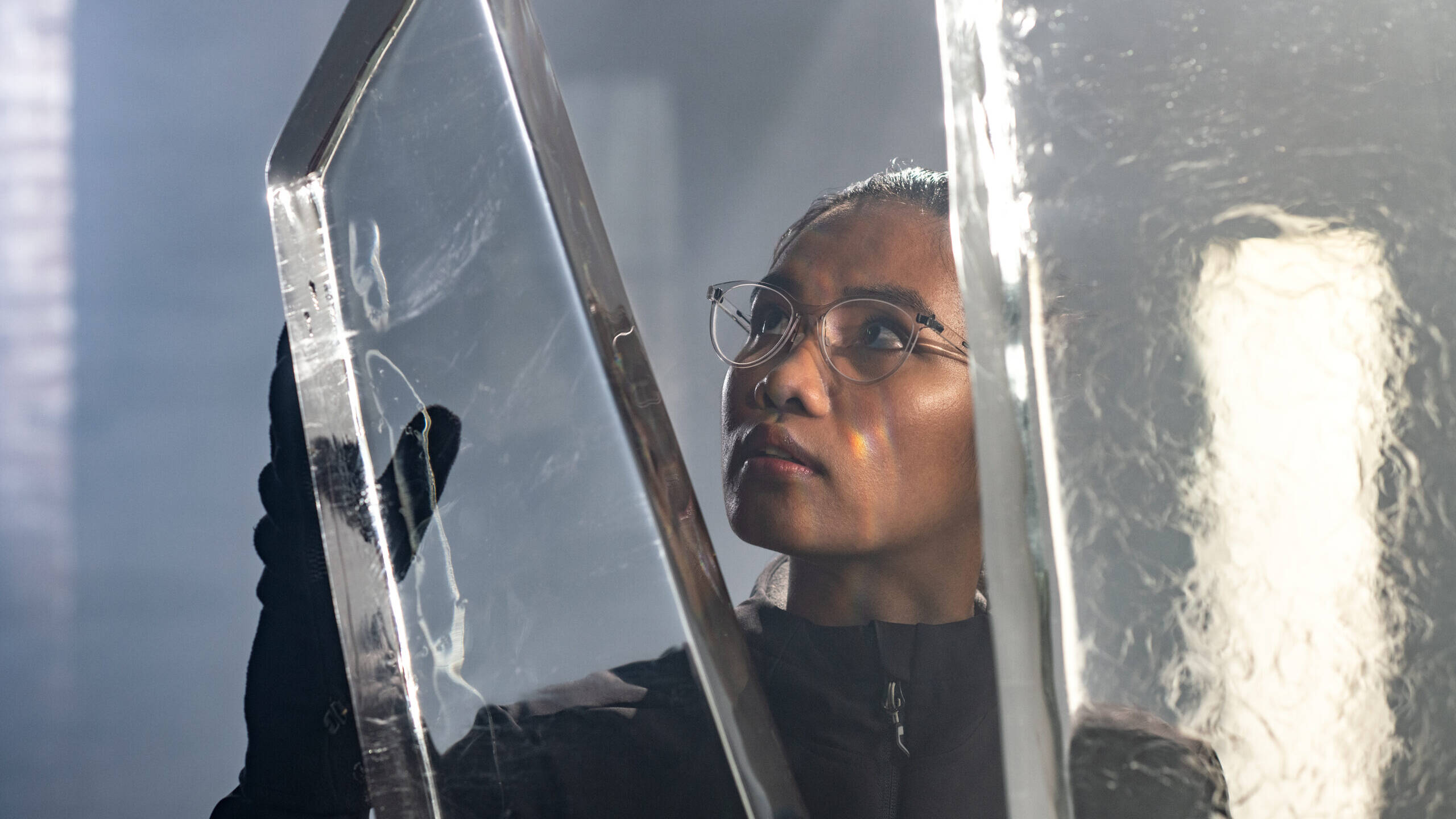 Female Ice Sculptor checking work