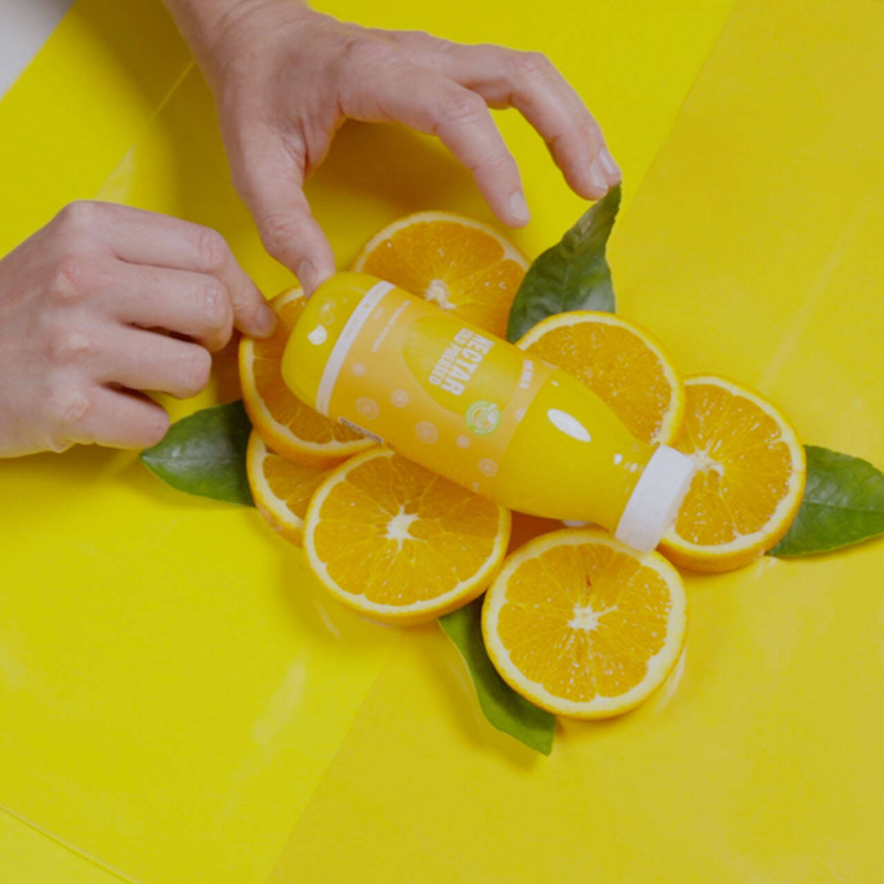 Flat lay orange juice photo shoot set-up