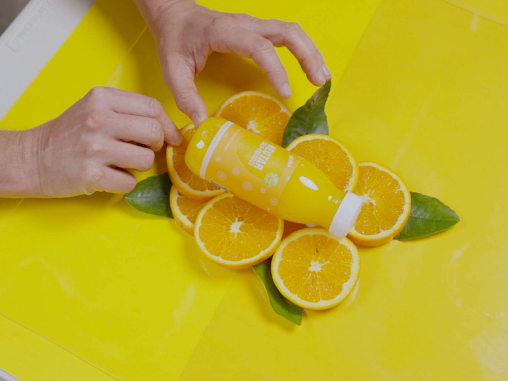 Flat lay orange juice photo shoot set-up
