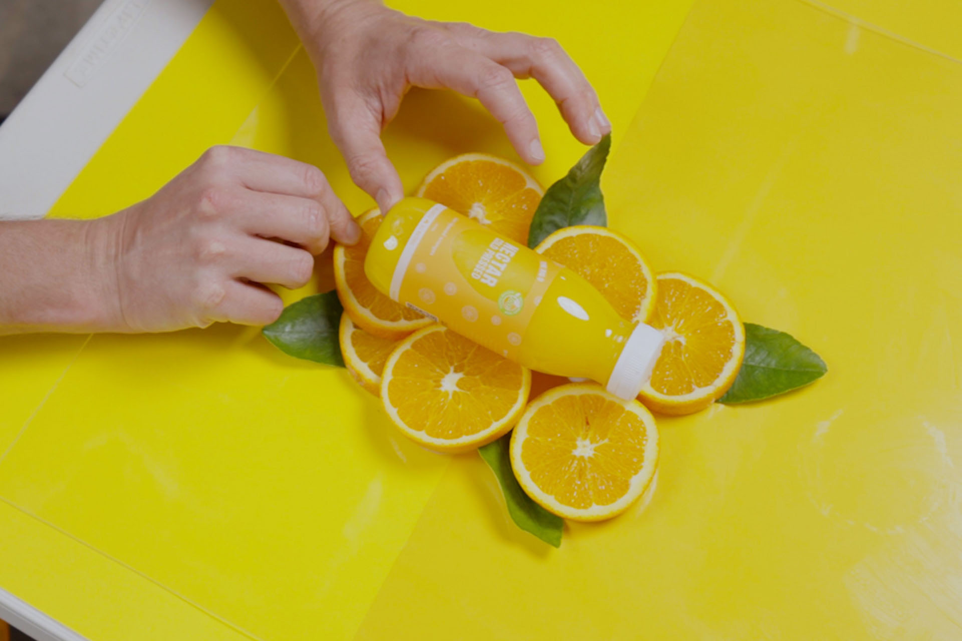 Flat lay orange juice photo shoot set-up