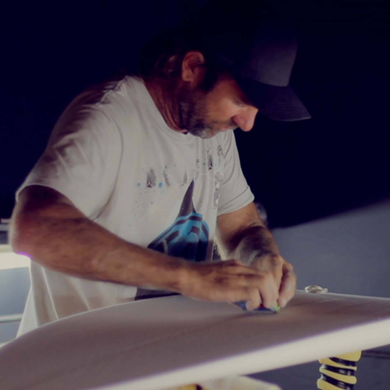 Surfer and board shaper Dylan Longbottom at work