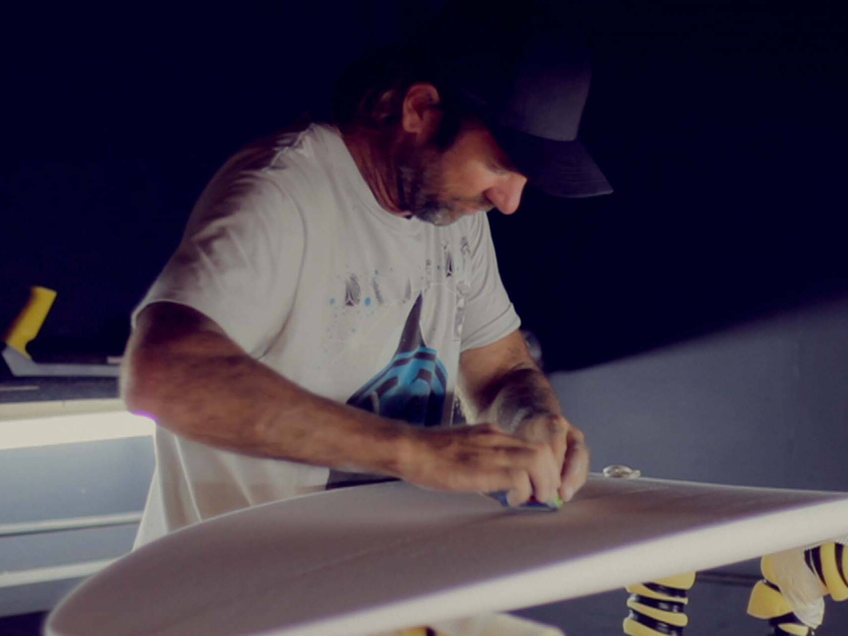 Surfer and board shaper Dylan Longbottom at work