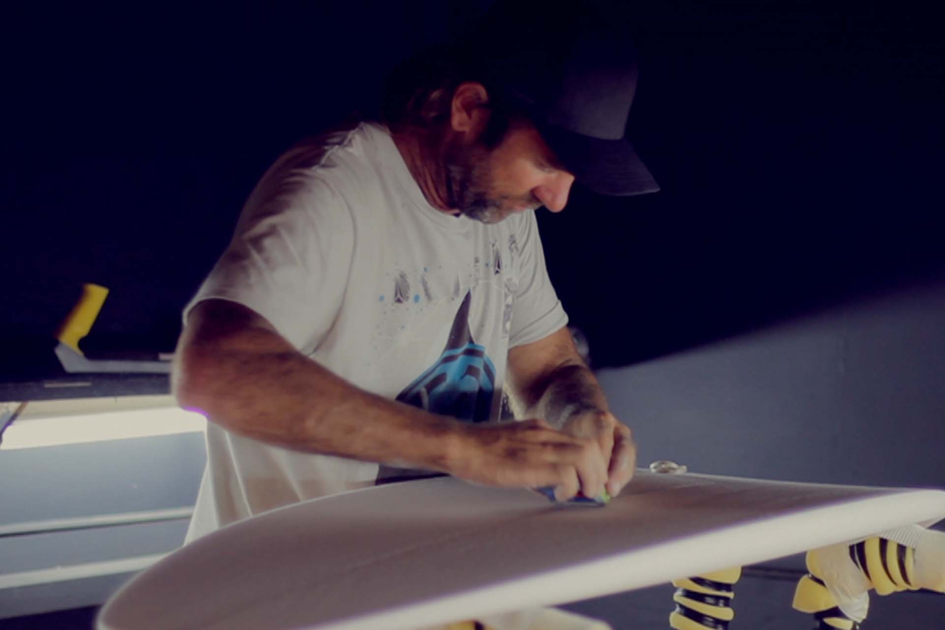 Surfer and board shaper Dylan Longbottom at work
