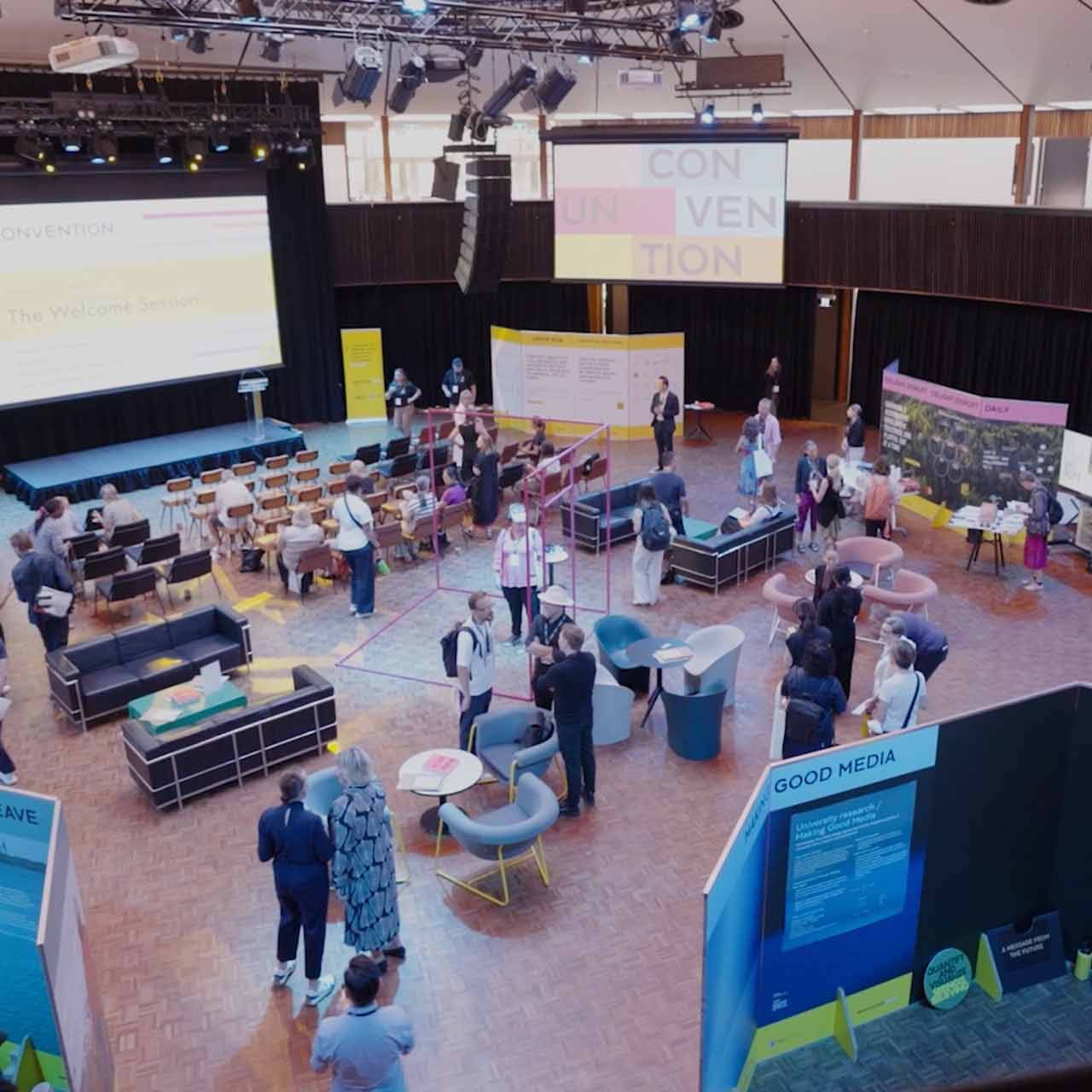 Wide shot of vibrant event space and people interacting
