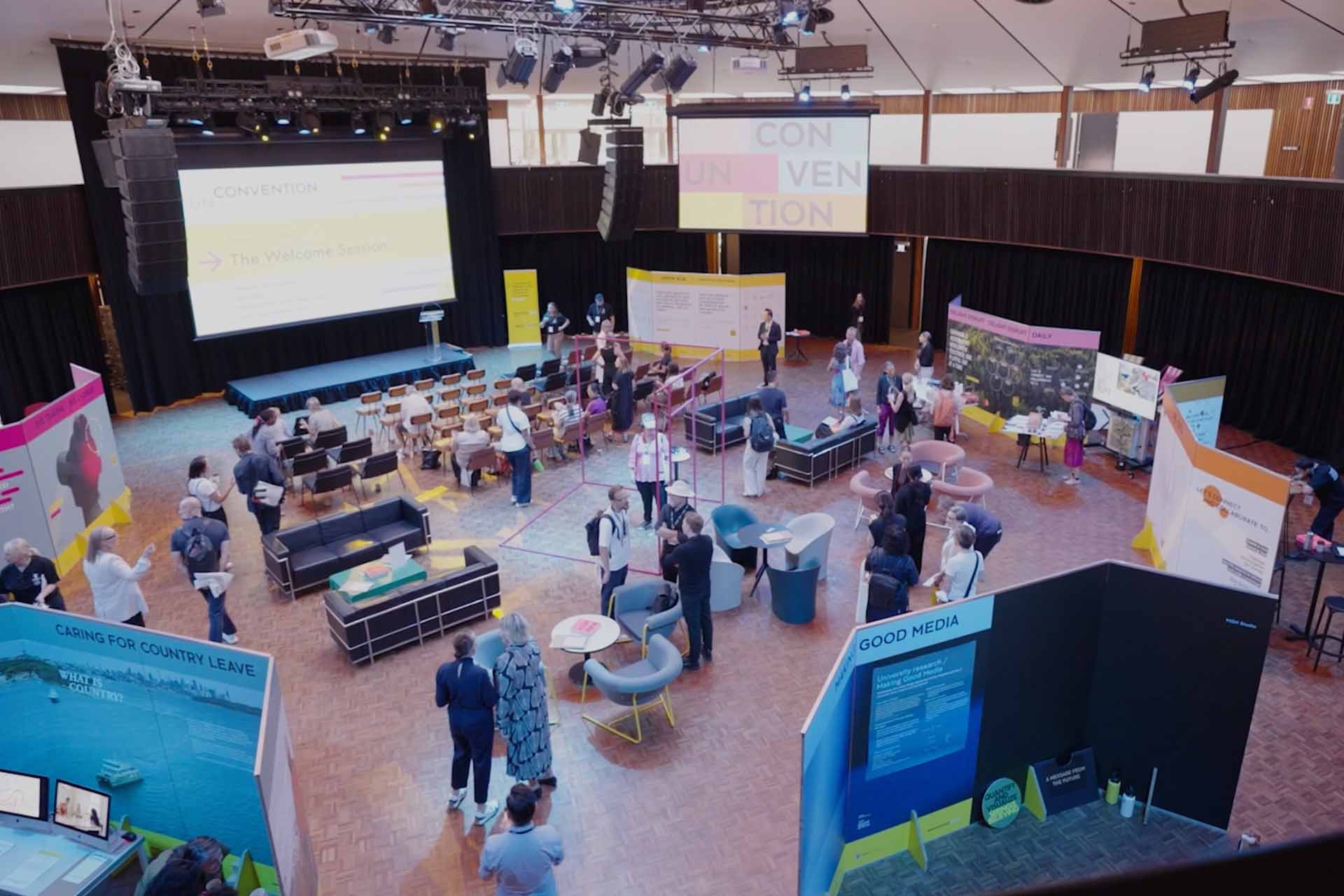 Wide shot of vibrant event space and people interacting
