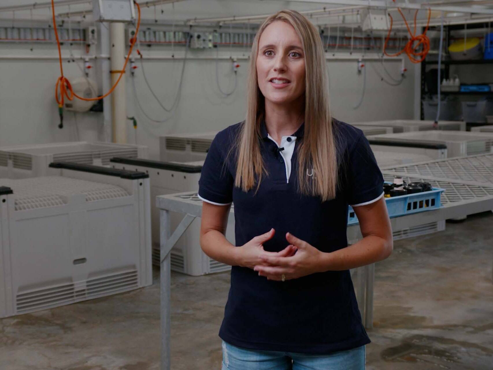 Woman speaking to camera in lab setting
